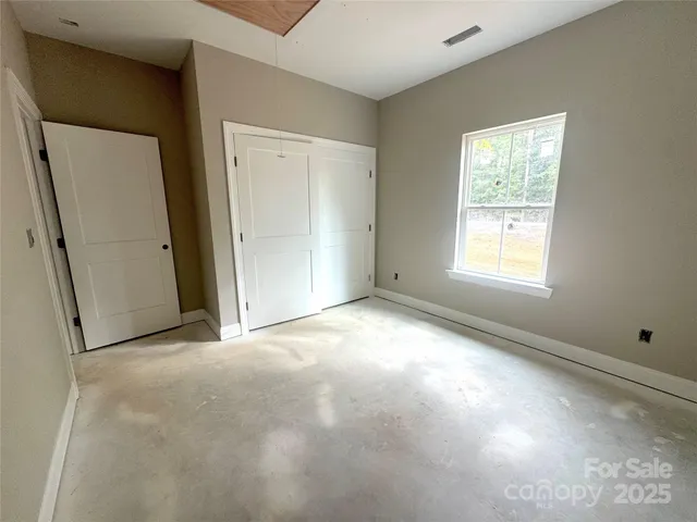 an empty room with windows