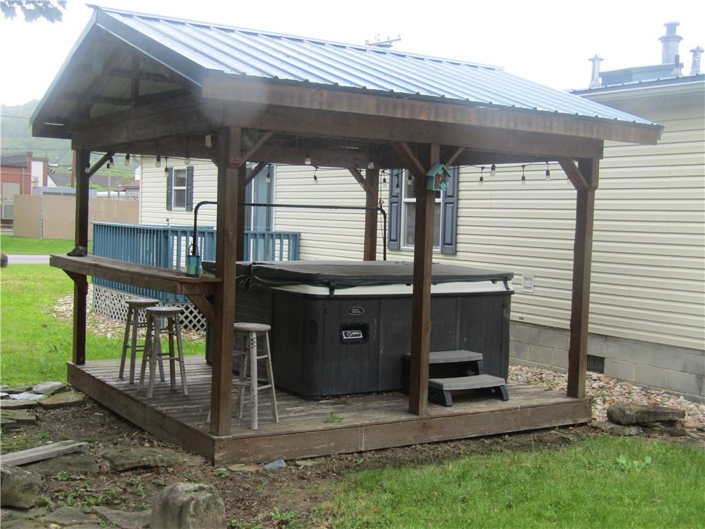 521 Williams Street Confluence, PA 15424 - Photo 24 of 38 a view of a porch with furniture and a gate