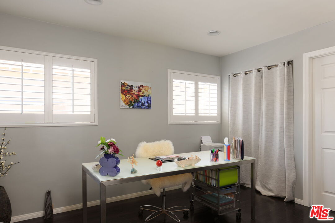 12416 Aneta Street Los Angeles, CA 90066 - Photo 13 of 22 a view of a workspace with furniture and a window