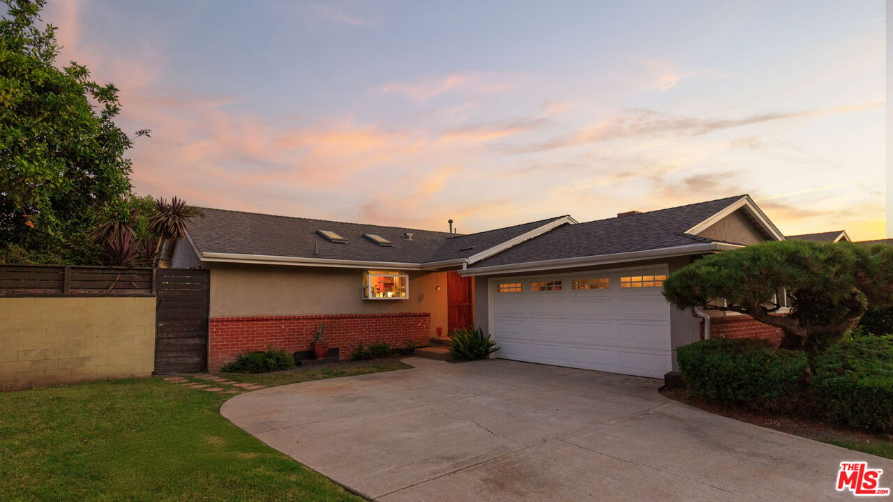 12416 Aneta Street Los Angeles, CA 90066 - Photo 20 of 22 a front view of a house with garden