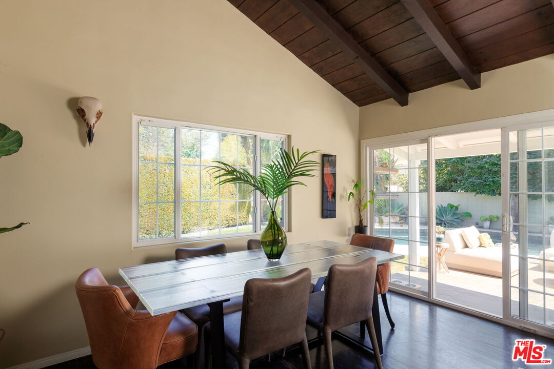 12416 Aneta Street Los Angeles, CA 90066 - Photo 6 of 22 a dining room with furniture window and wooden floor