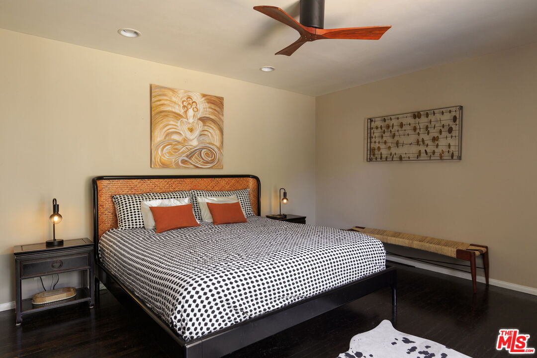 12416 Aneta Street Los Angeles, CA 90066 - Photo 7 of 22 a bedroom with a bed and paintings on the wall