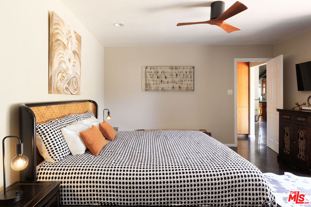 12416 Aneta Street Los Angeles, CA 90066 - Photo 8 of 22 a bedroom with a bed and wooden floor