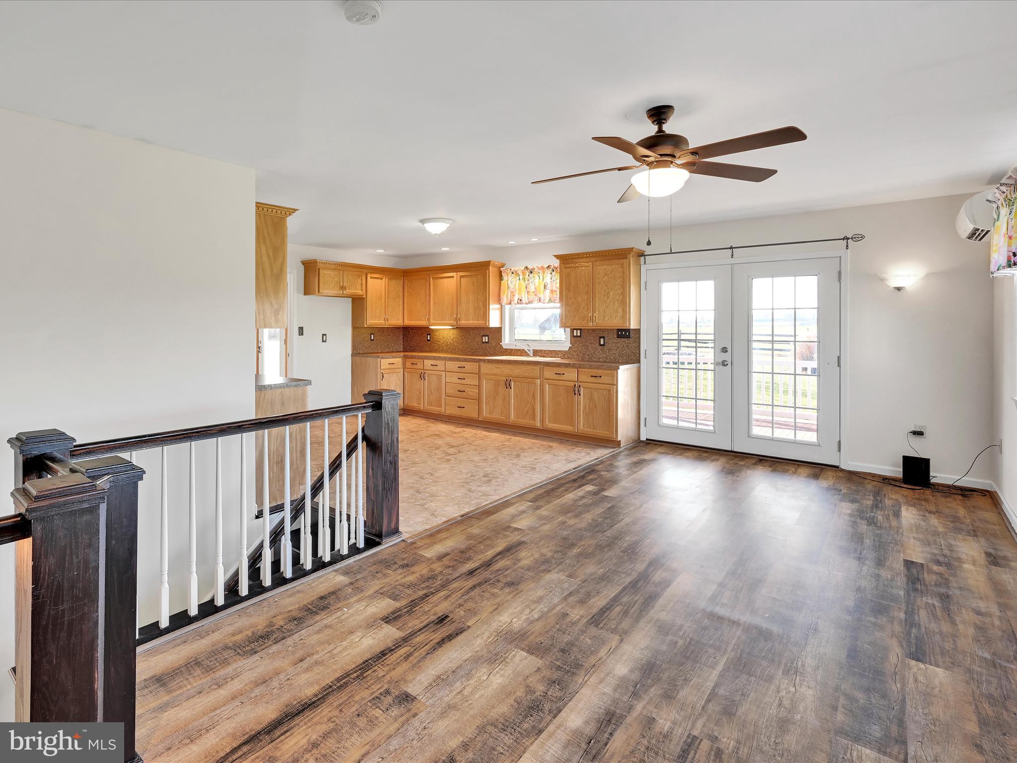 20 Bomberger Road Lititz, PA 17543 - Photo 19 of 50 a view of a livingroom with wooden floor a ceiling fan and windows