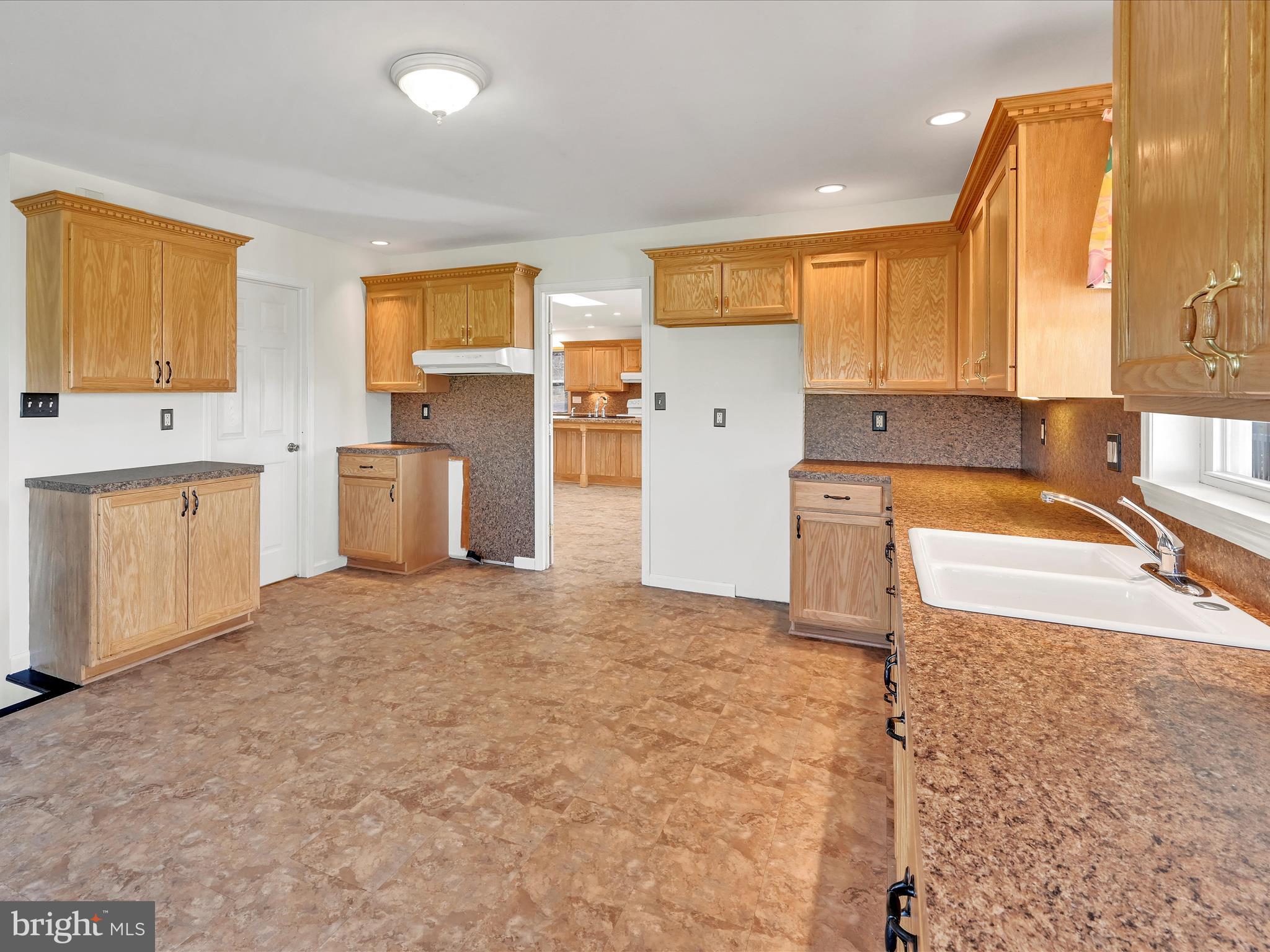 20 Bomberger Road Lititz, PA 17543 - Photo 21 of 50 a view of a kitchen with a sink dishwasher refrigerator stove a sink dishwasher and wooden cabinets