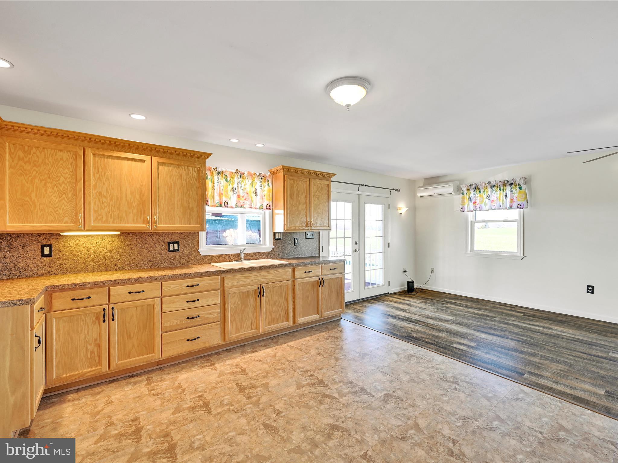 20 Bomberger Road Lititz, PA 17543 - Photo 23 of 50 a large kitchen with granite countertop a stove a sink and a window