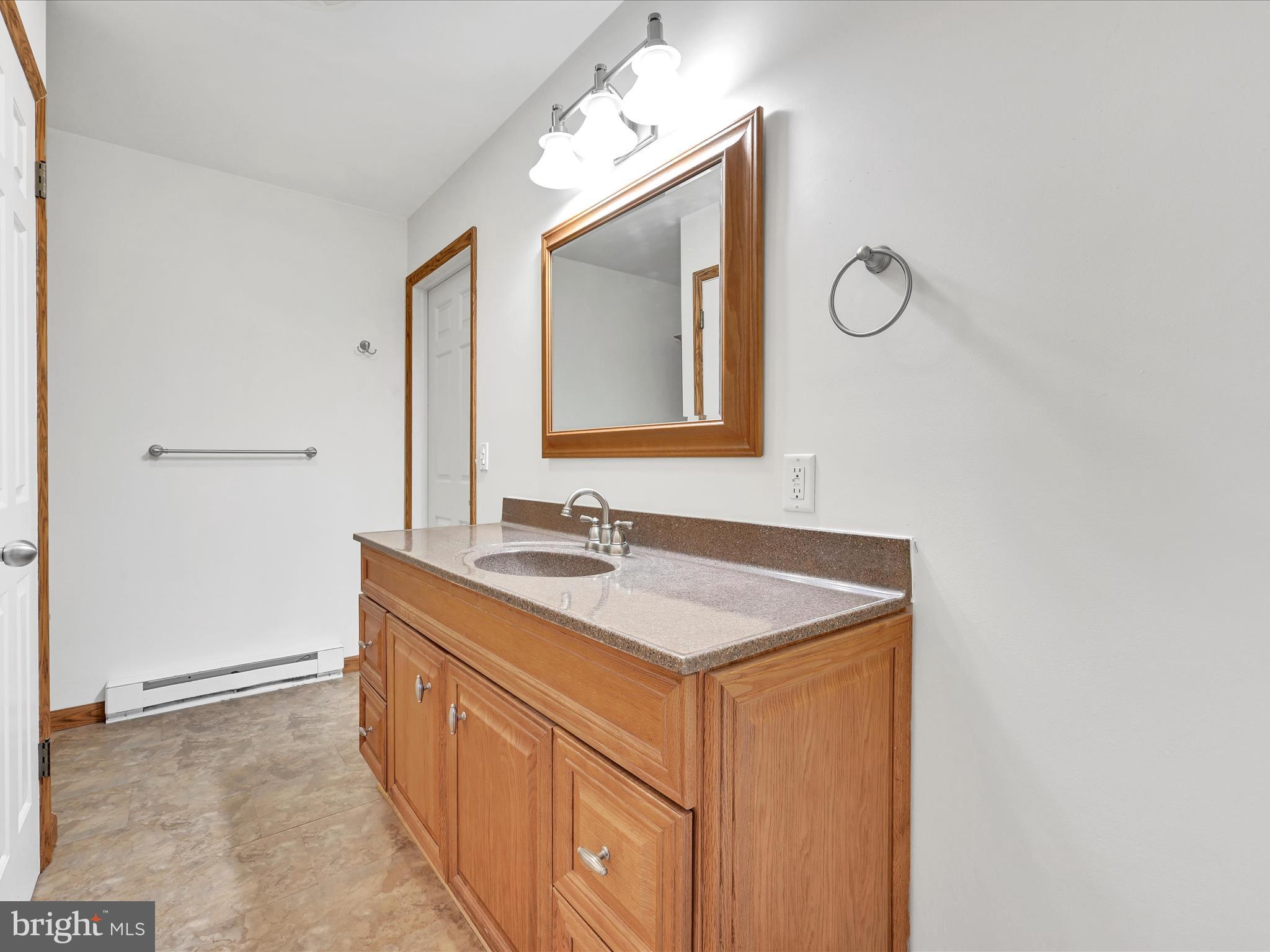 20 Bomberger Road Lititz, PA 17543 - Photo 38 of 50 a bathroom with a sink vanity and mirror