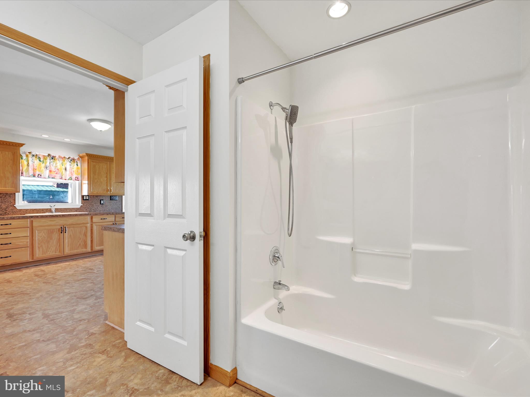 20 Bomberger Road Lititz, PA 17543 - Photo 39 of 50 a bathroom with a bathtub and a shower