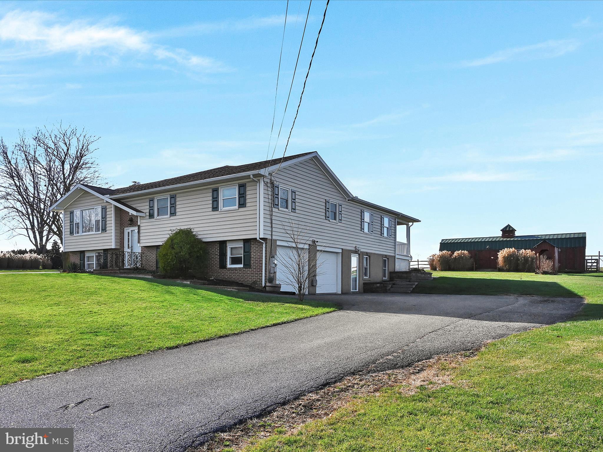 20 Bomberger Road Lititz, PA 17543 - Photo 5 of 50 a front view of house with yard and green space