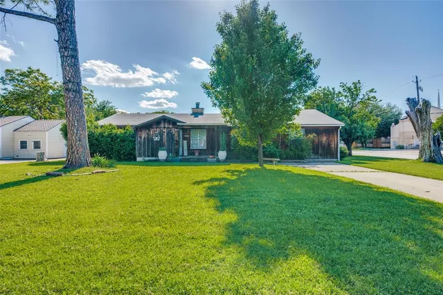 a view of house with swimming pool