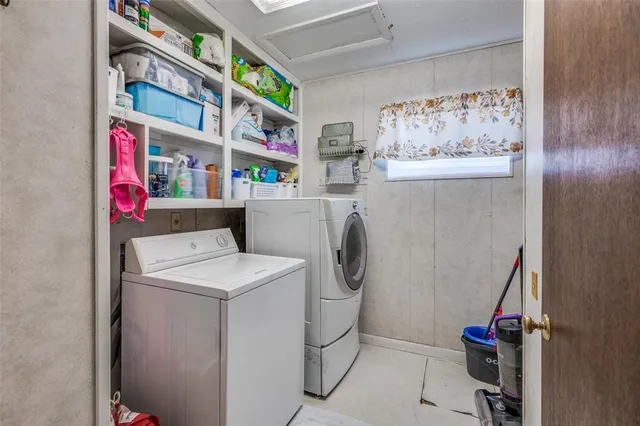 a utility room with dryer and washer