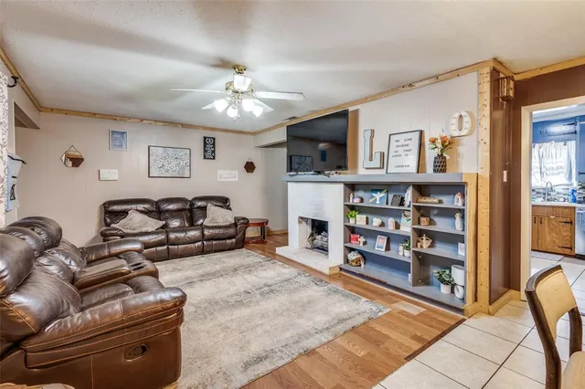 a living room with furniture and a bookshelf