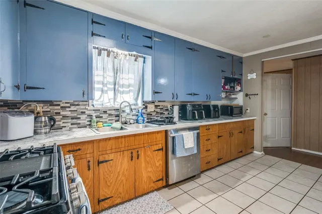 a kitchen with stainless steel appliances granite countertop a sink and cabinets