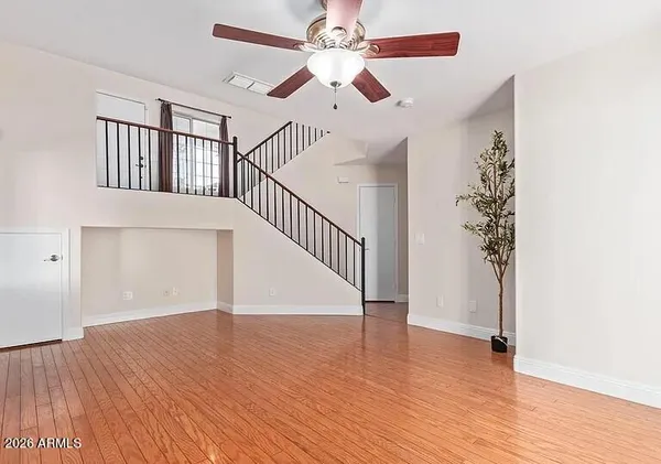 wooden floor in an empty room with a window and wooden floor