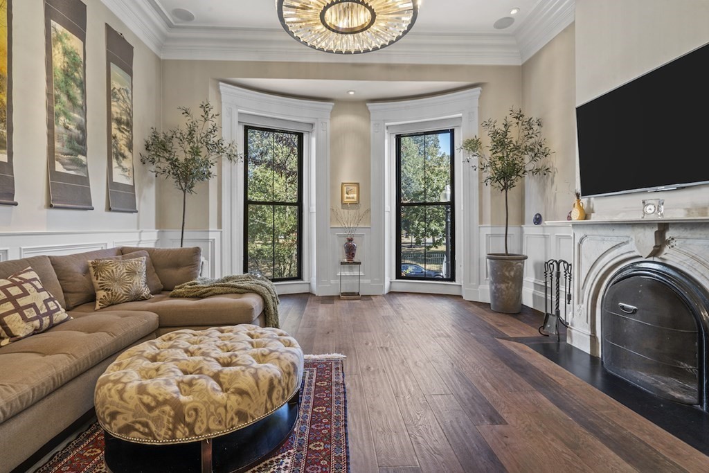 a living room with fireplace furniture and a flat screen tv