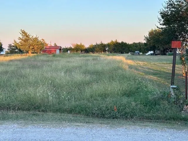 a view of a lake with a yard