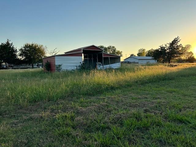 Tba Live Oak Road Princeton, TX 75407 - Photo 11 of 15 a view of a lake with a house in the background