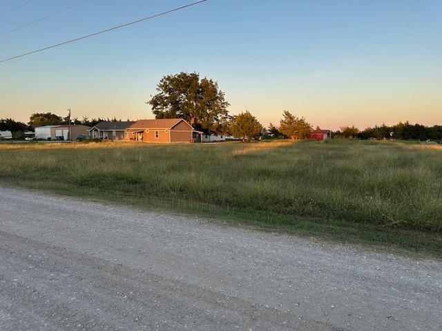 Tba Live Oak Road Princeton, TX 75407 - Photo 2 of 15 a view of a lake with houses in background