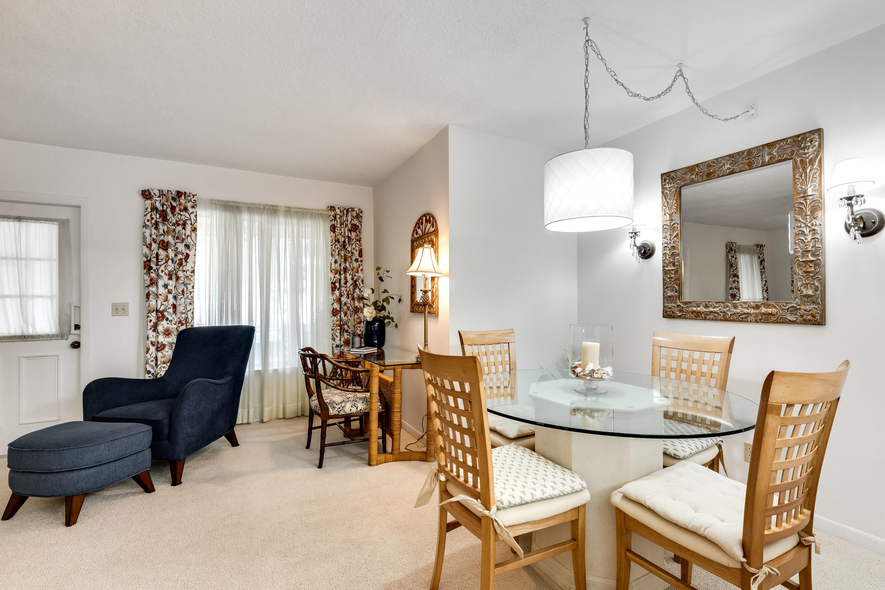 122 Lake Pine Circle, Unit B1 Greenacres, FL 33463 - Photo 13 of 36 a view of a dining room with furniture and wooden floor