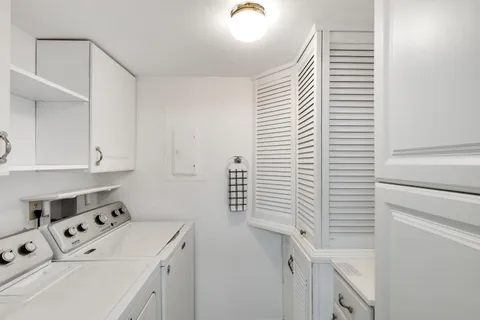 a spacious bedroom with a bed and a window