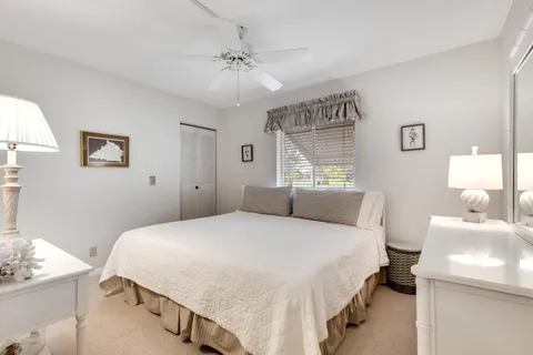 a bedroom with a bed and a lamp