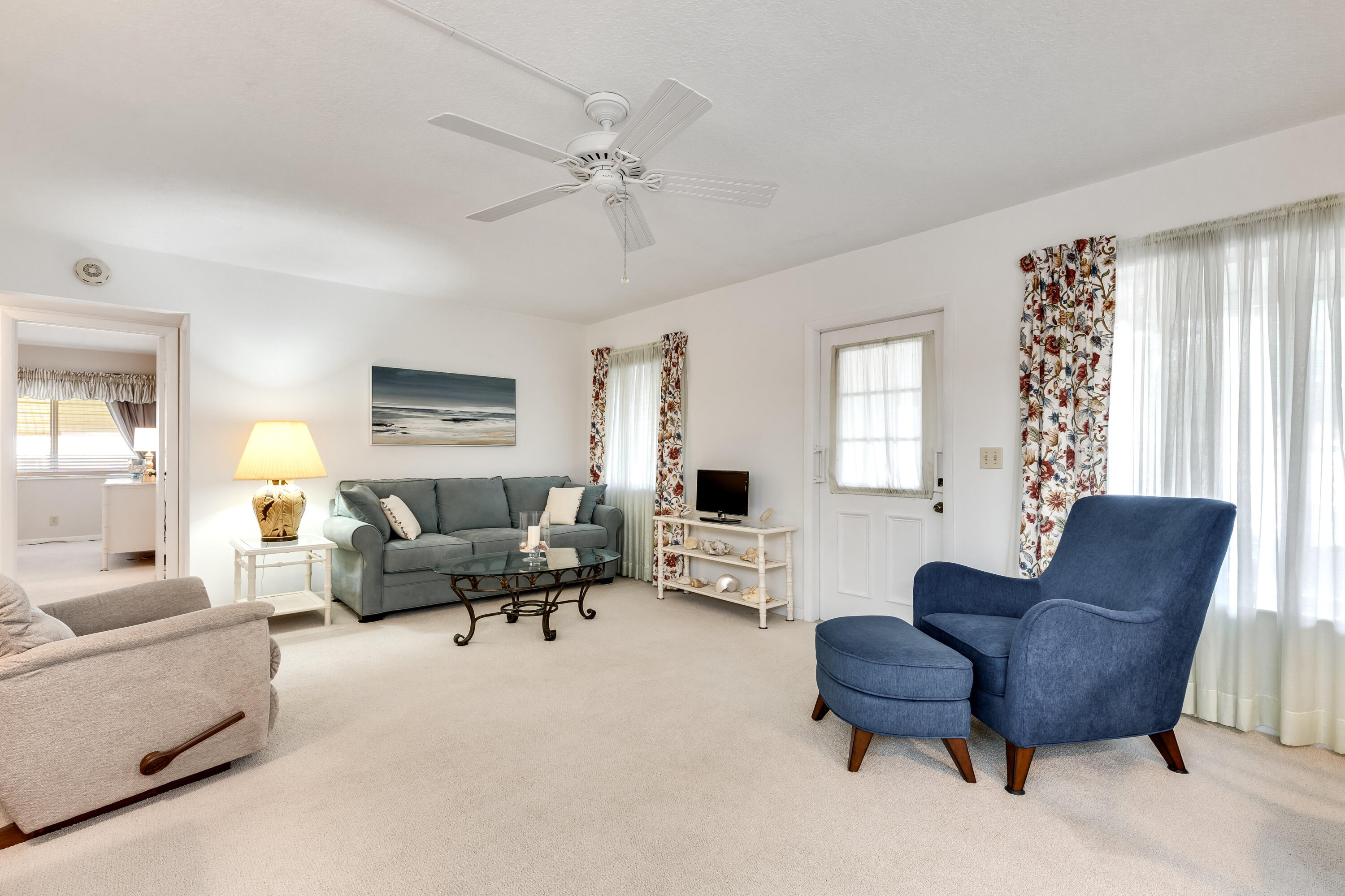122 Lake Pine Circle, Unit B1 Greenacres, FL 33463 - Photo 6 of 36 a living room with furniture and a large window