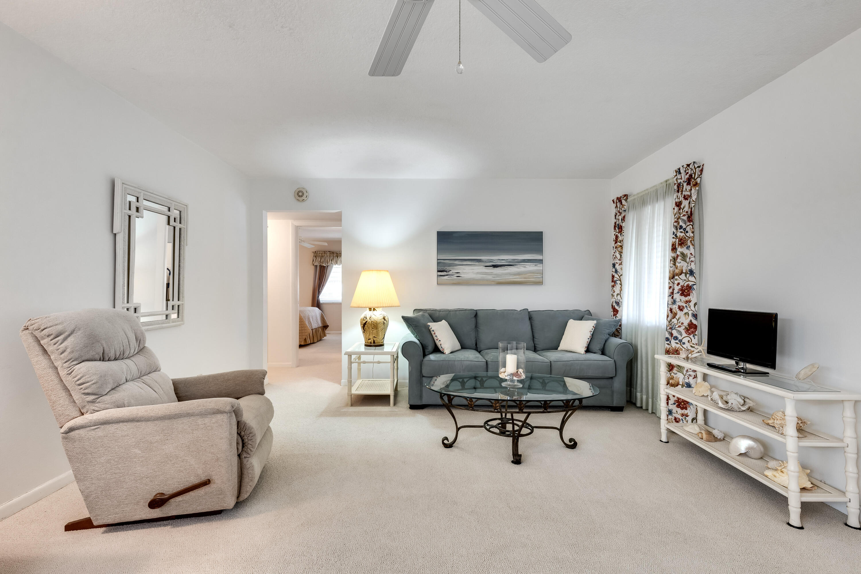122 Lake Pine Circle, Unit B1 Greenacres, FL 33463 - Photo 7 of 36 a living room with furniture and a flat screen tv