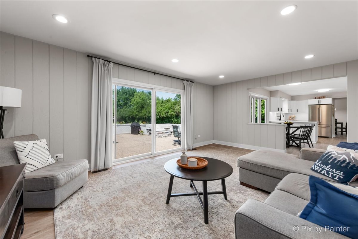 906 Edward Street Wheeling, IL 60090 - Photo 14 of 34 a living room with furniture and a table