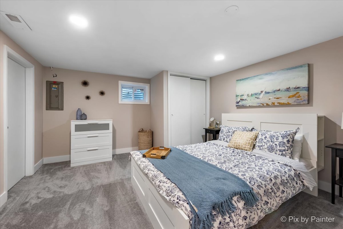 906 Edward Street Wheeling, IL 60090 - Photo 25 of 34 a bedroom with a bed and a view of kitchen