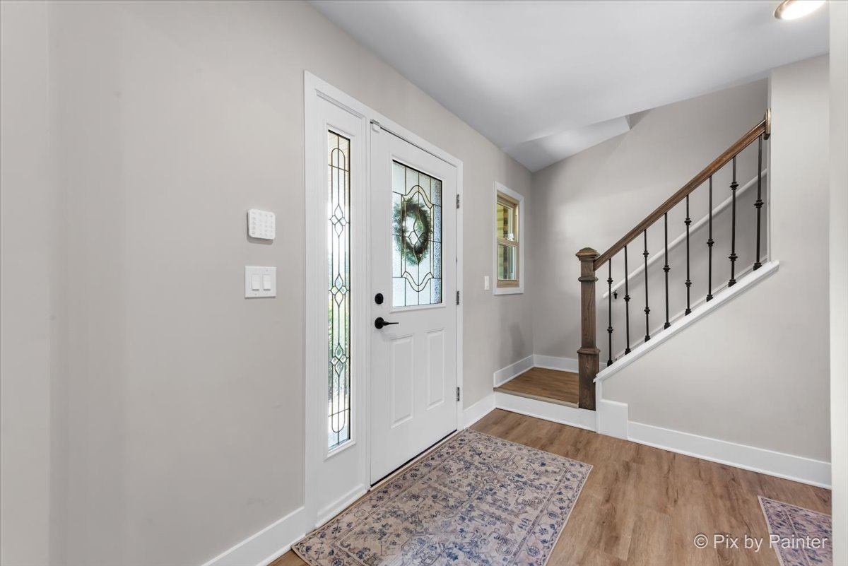 906 Edward Street Wheeling, IL 60090 - Photo 3 of 34 a view of an entryway with wooden floor