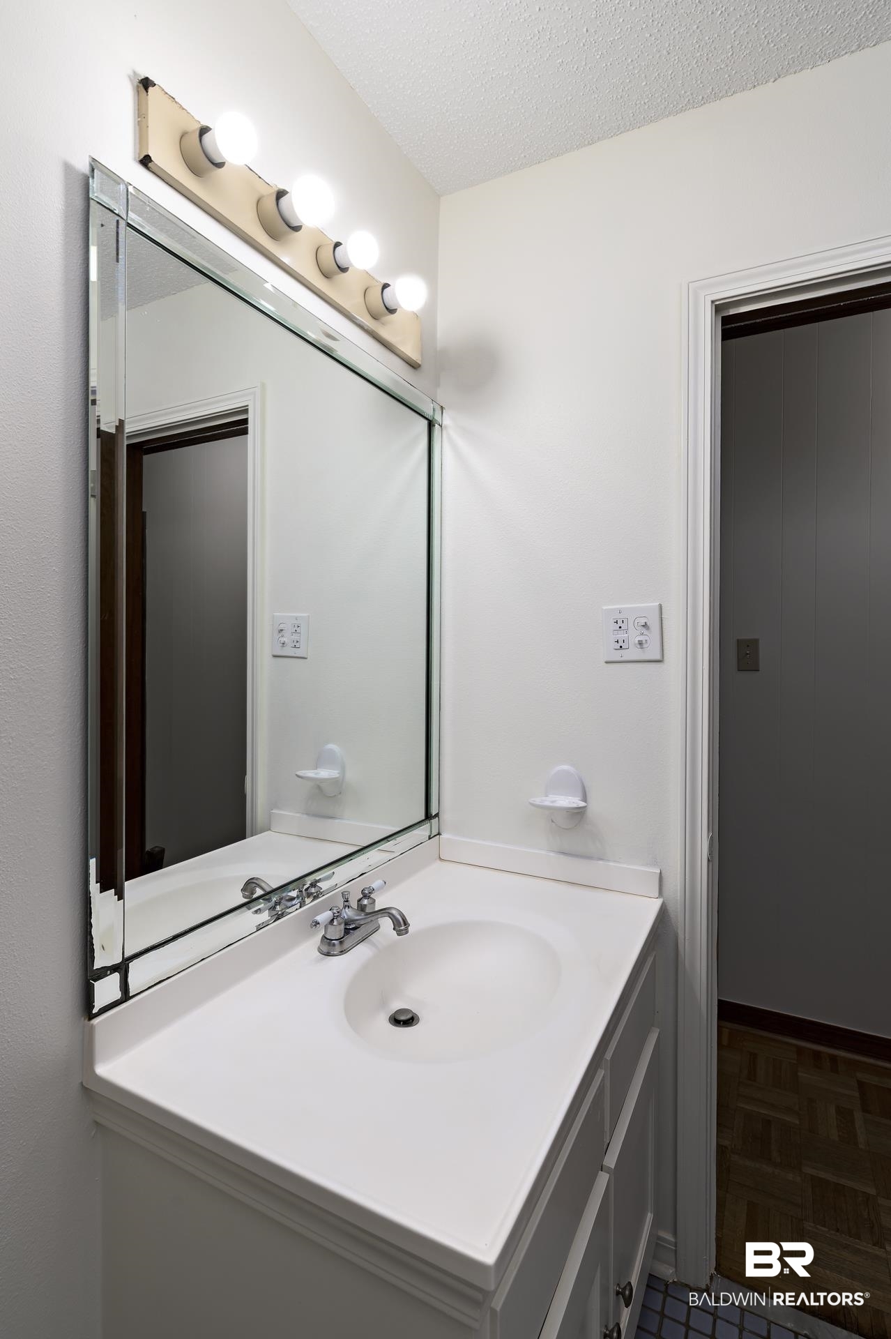 707 Johnson Avenue Fairhope, AL 36532 - Photo 23 of 38 Bathroom featuring a textured ceiling and vanity