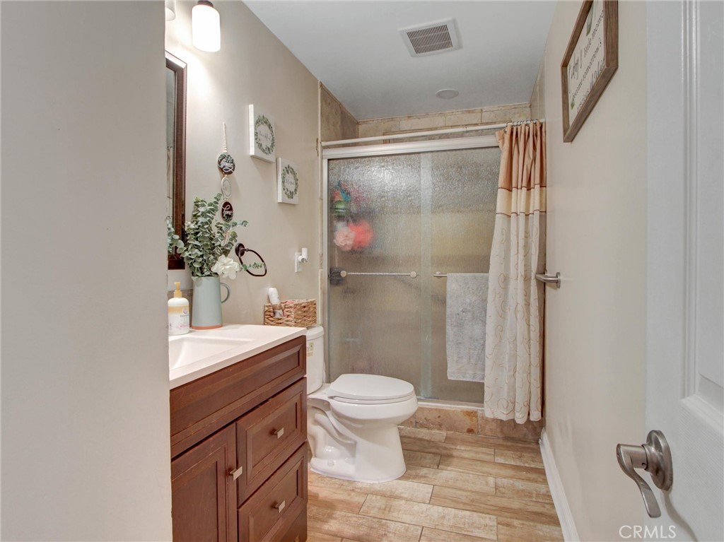 10922 Vickers Drive Garden Grove, CA 92840 - Photo 11 of 25 a bathroom with a sink a toilet and shower