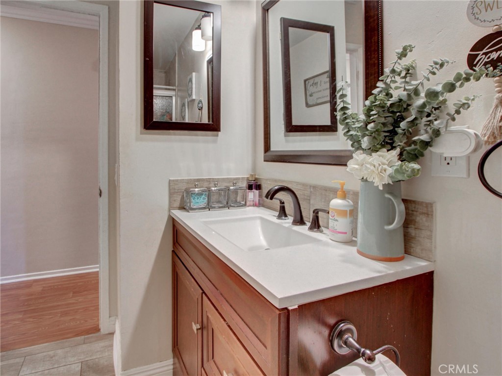 10922 Vickers Drive Garden Grove, CA 92840 - Photo 12 of 25 a bathroom with a sink and a mirror