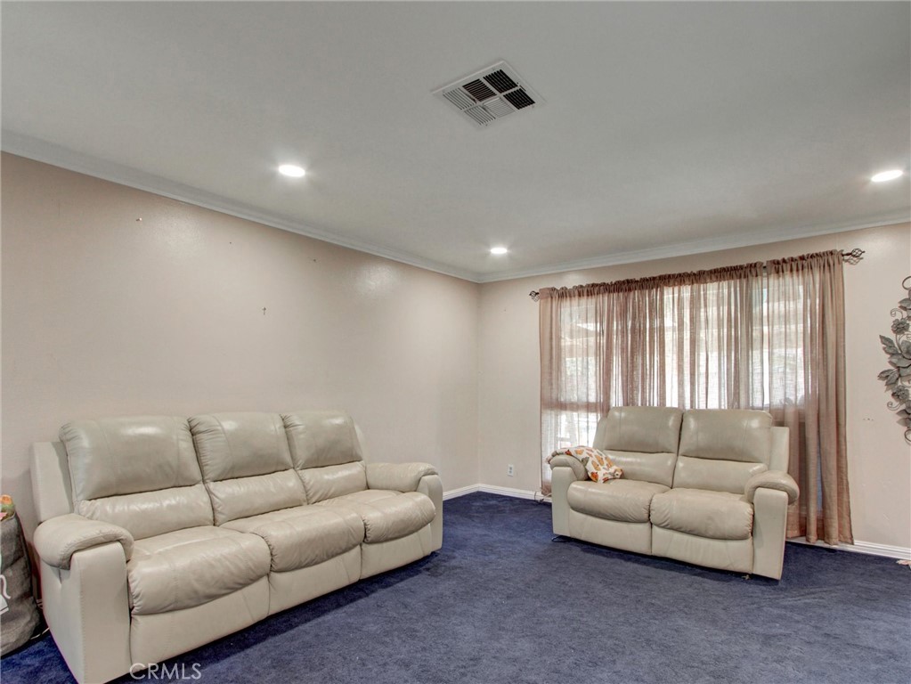 10922 Vickers Drive Garden Grove, CA 92840 - Photo 6 of 25 a living room with furniture and a window
