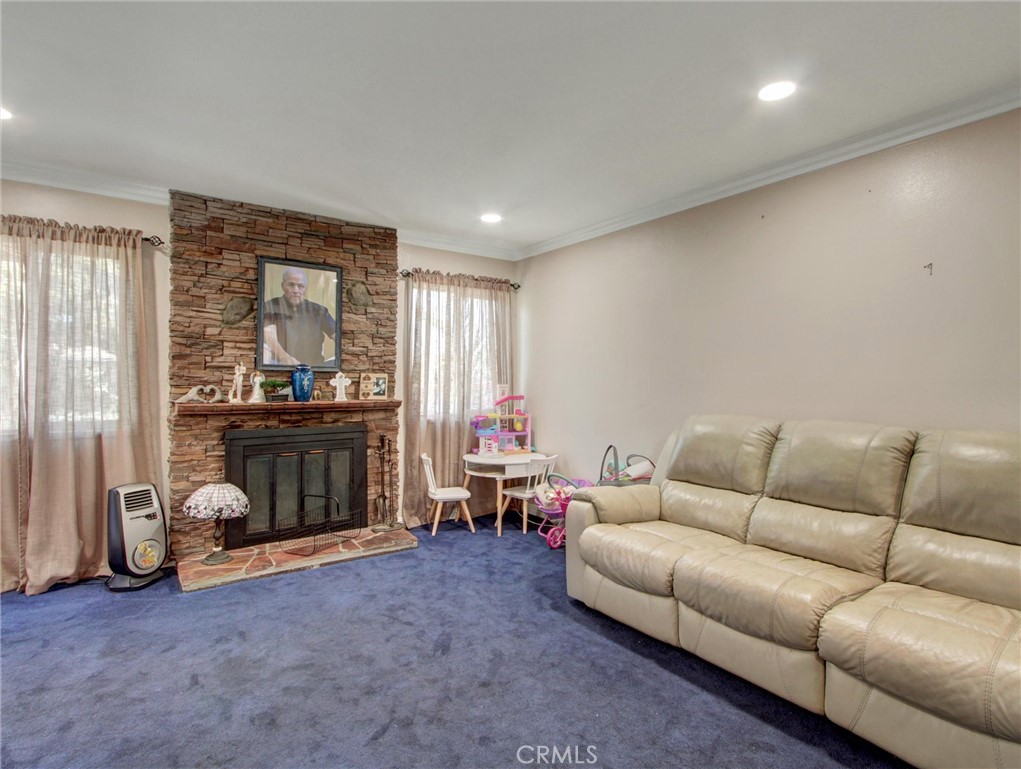 10922 Vickers Drive Garden Grove, CA 92840 - Photo 7 of 25 a living room with furniture and a window