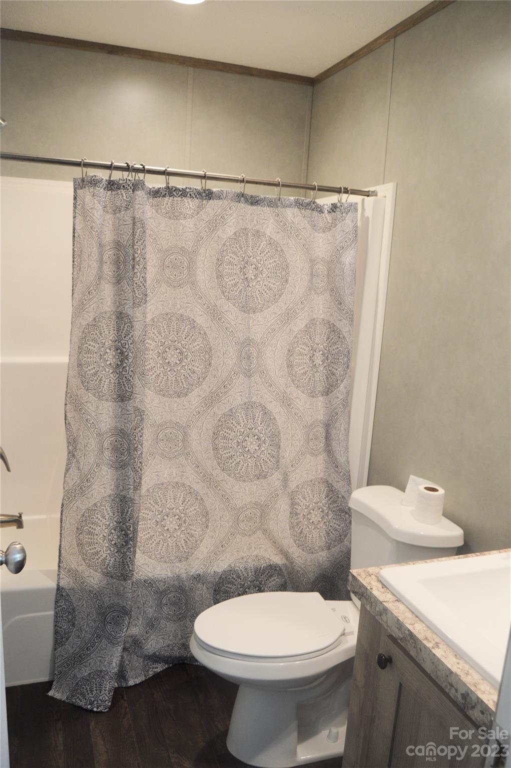6418 Dysartsville Road Morganton, NC 28655 - Photo 19 of 20 a bathroom with a sink a toilet and a shower curtain