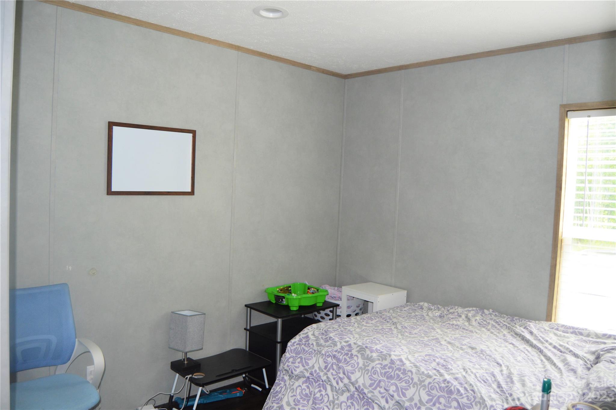 6418 Dysartsville Road Morganton, NC 28655 - Photo 20 of 20 a bedroom with a bed and a chair