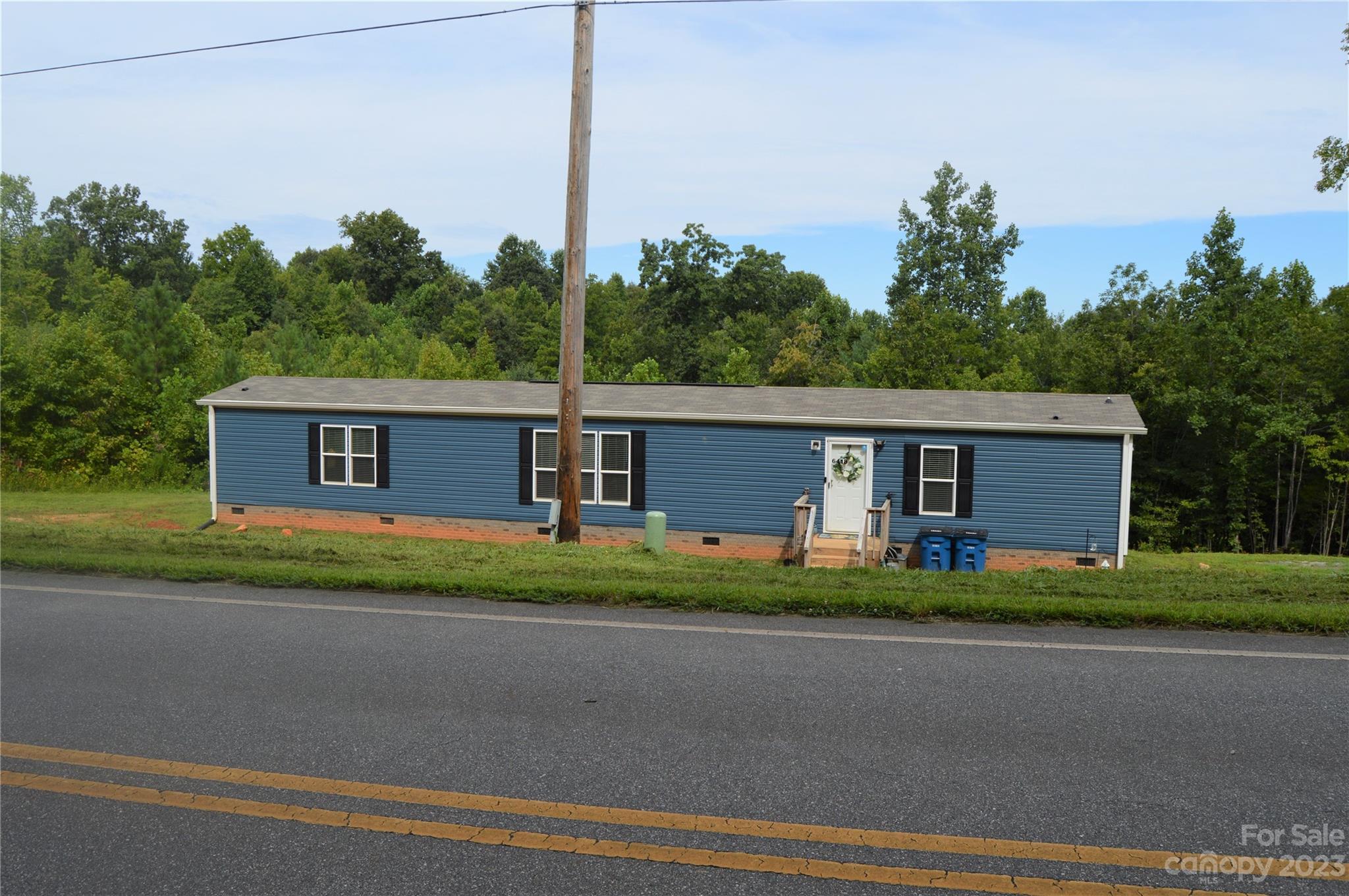 6418 Dysartsville Road Morganton, NC 28655 - Photo 4 of 20 a front view of a house with a yard and garage