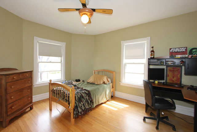 311 South Ridgeland Avenue Oak Park, IL 60302 - Photo 16 of 25 a bedroom with a bed and a desk