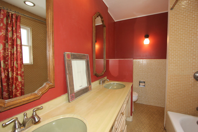 311 South Ridgeland Avenue Oak Park, IL 60302 - Photo 20 of 25 a bathroom with a sink and mirror with toilet