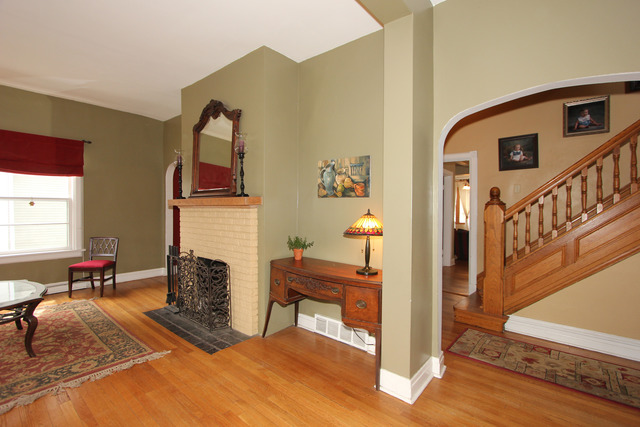 311 South Ridgeland Avenue Oak Park, IL 60302 - Photo 3 of 25 a living room with furniture and a fireplace