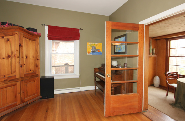 311 South Ridgeland Avenue Oak Park, IL 60302 - Photo 6 of 25 a view of wooden floor and windows in a room