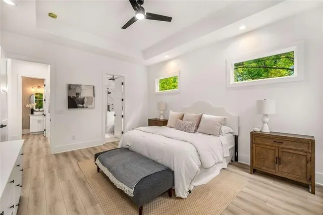 a bedroom with a bed and a couch