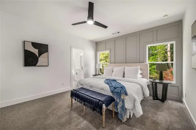 a bed room with a bed and a television