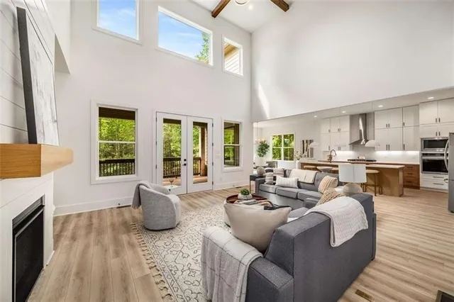 a living room with furniture fireplace and window