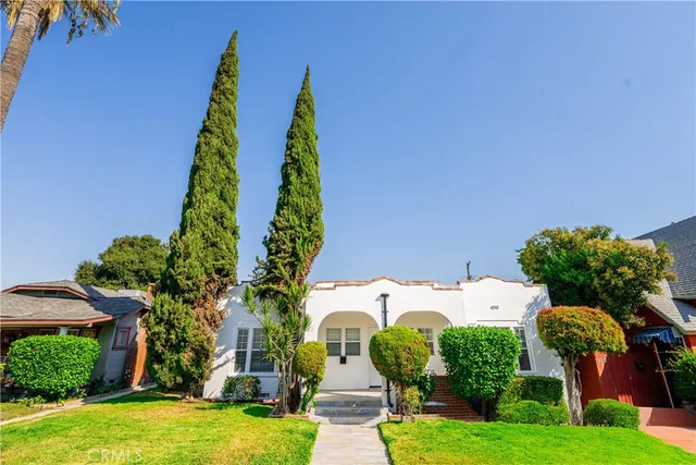 an aerial view of multiple houses with yard