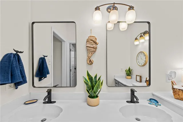 a bathroom with a sink and mirror