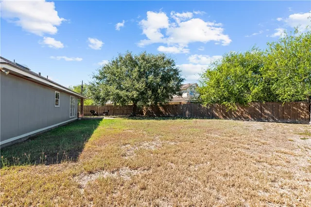 a backyard of a house with lots of green space