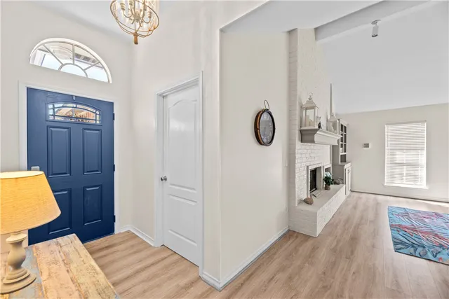 a bedroom with a bed and a chair in it