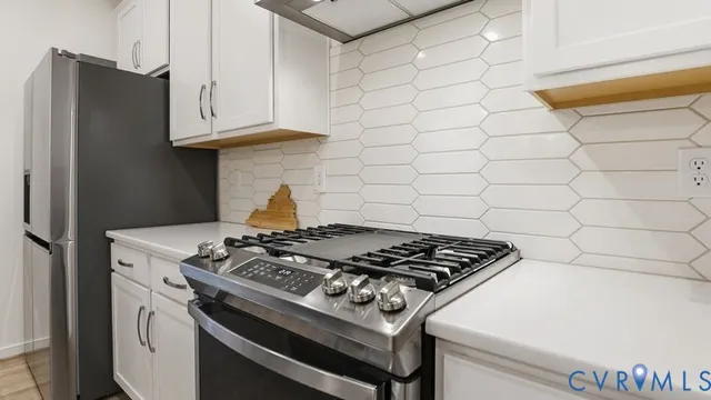 a bedroom with a bed next to a window